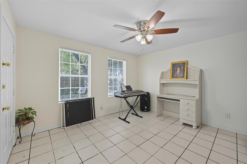 3334 Sheldon Avenue Dallas, TX 75211 - Photo 17 of 22 Office area featuring light tile patterned flooring and ceiling fan