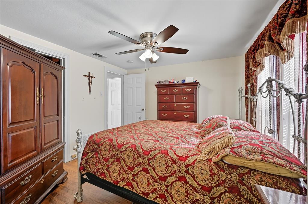 3334 Sheldon Avenue Dallas, TX 75211 - Photo 21 of 22 Bedroom featuring wood finished floors and a ceiling fan