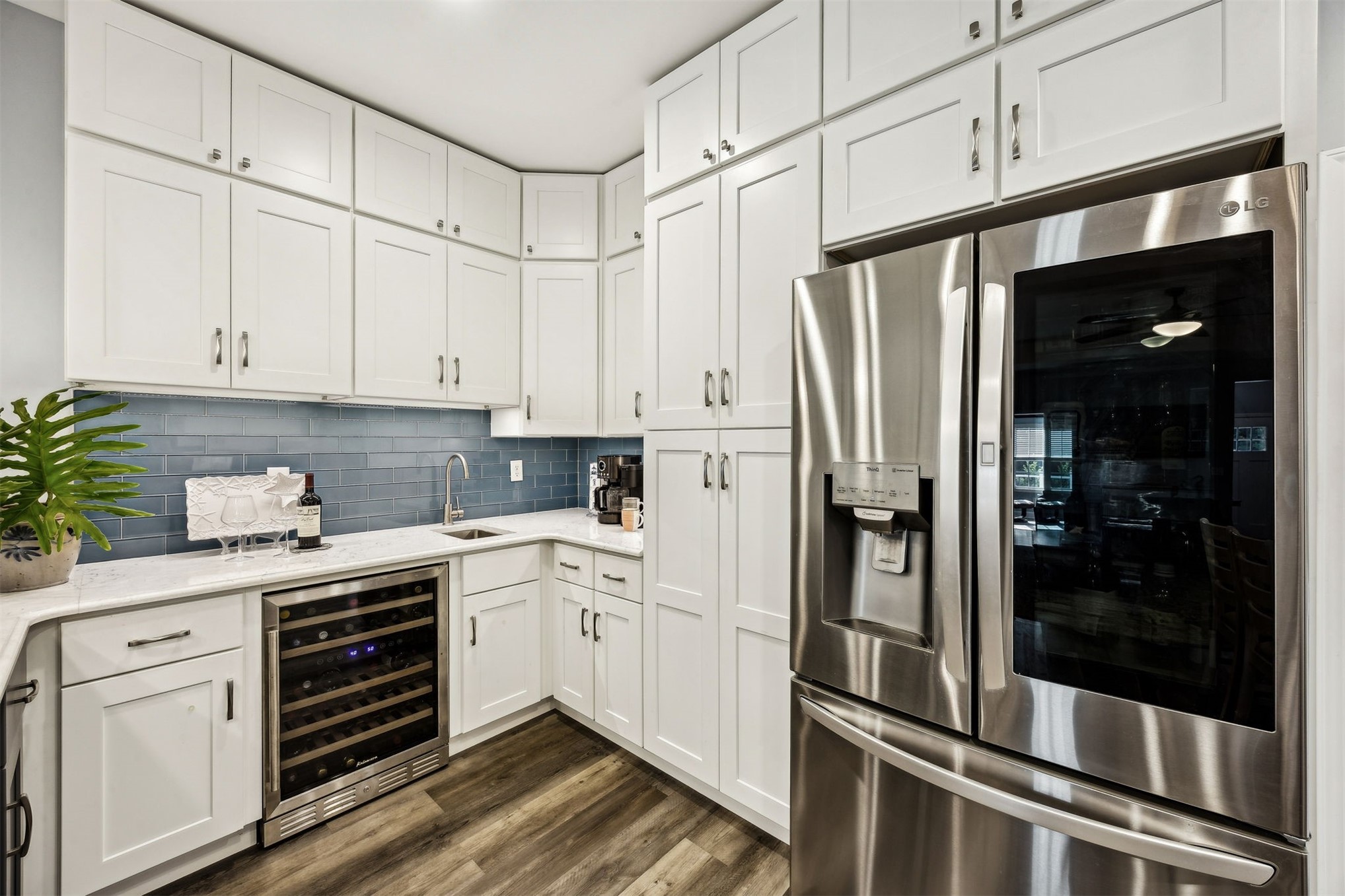 307 Elm Street Fernandina Beach, FL 32034 - Photo 7 of 35 a kitchen with white cabinets and white appliances