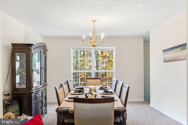 a kitchen with stainless steel appliances granite countertop wooden cabinets a stove top oven a sink and dishwasher