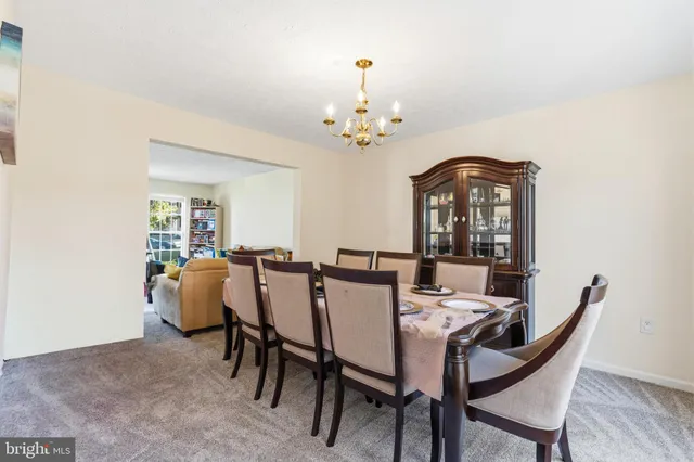 a kitchen with kitchen island granite countertop wooden cabinets a stove top oven a sink and dishwasher