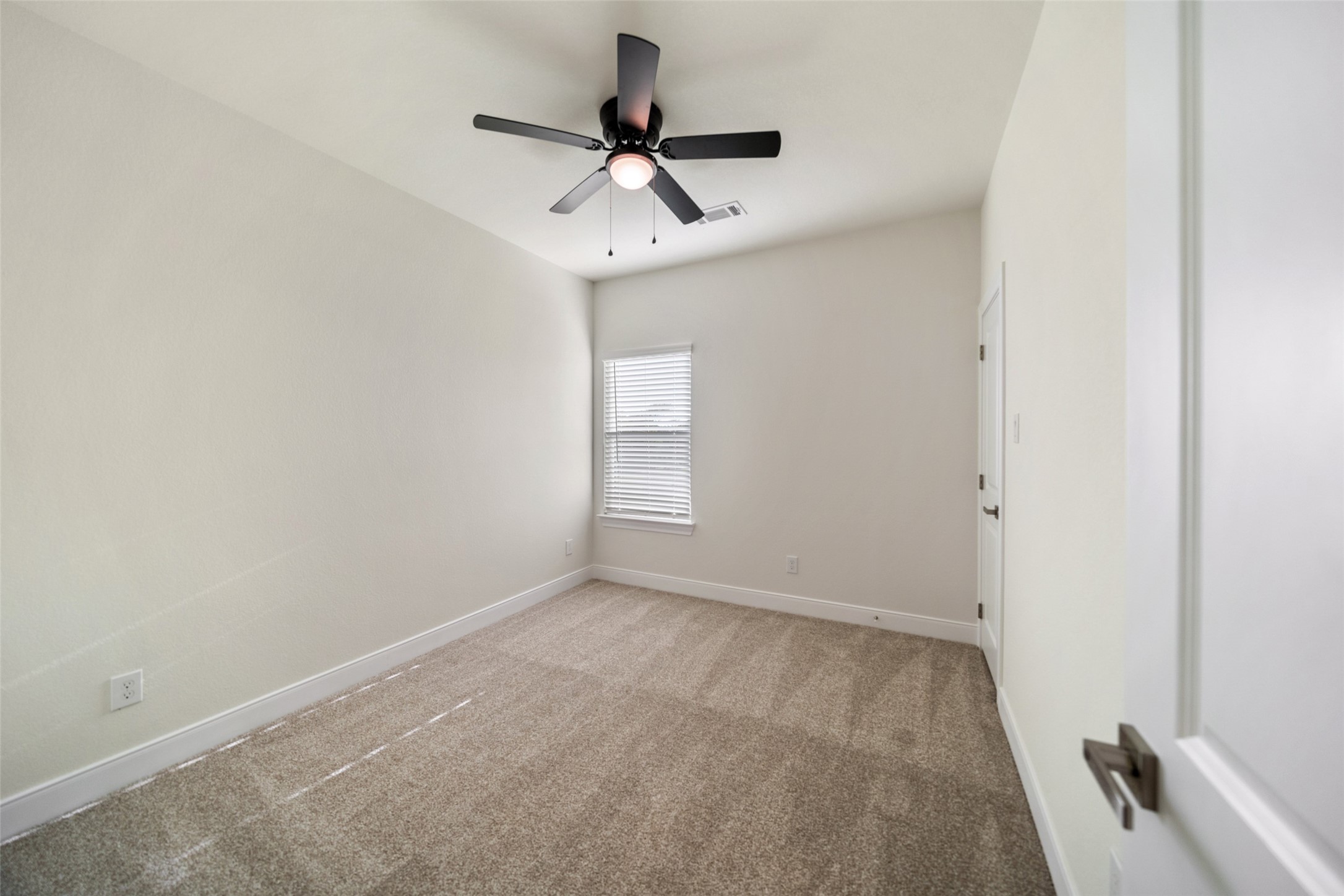 412 West Marlin Street Willis, TX 77378 - Photo 18 of 22 a view of room with a ceiling fan