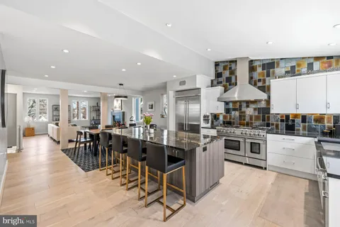 a kitchen with lots of counter top space and stainless steel appliances