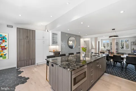 a kitchen with stainless steel appliances granite countertop a stove and a sink