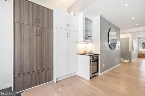 a kitchen with stainless steel appliances granite countertop a refrigerator a stove and a sink