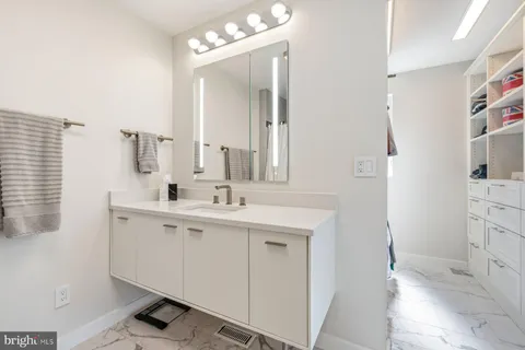 a bathroom with a sink double vanity and a mirror