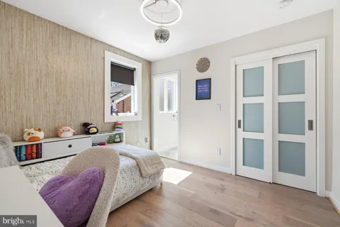 a bed room with a bed and a window