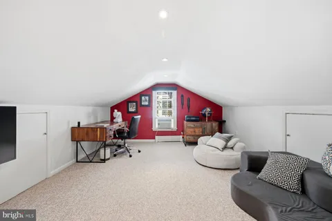 a bedroom with furniture and a couch