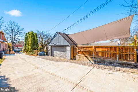 a view of a house with basketball court