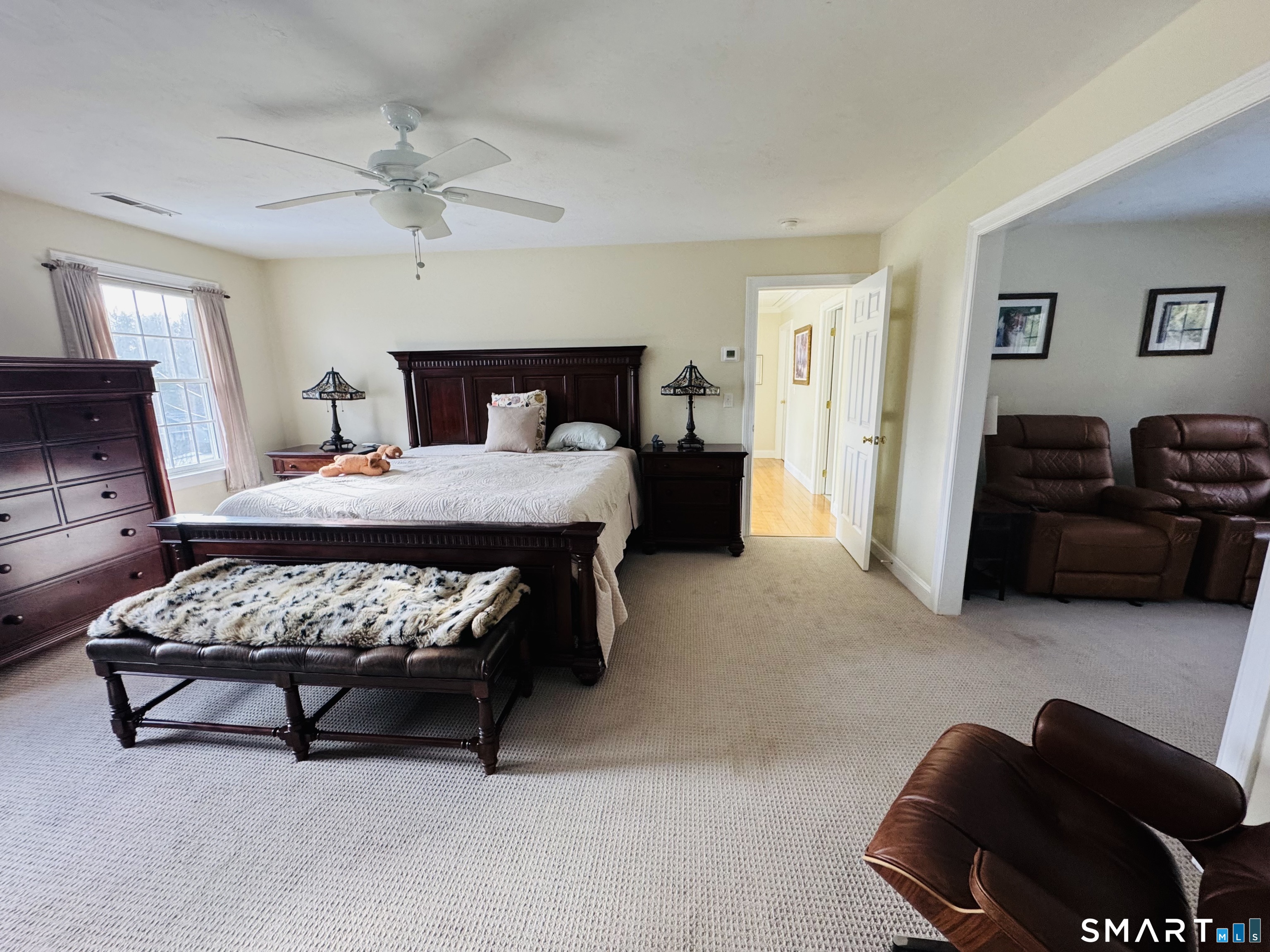 1350 Thompson Road Thompson, CT 06277 - Photo 13 of 39 a bedroom with a bed a couch and dresser
