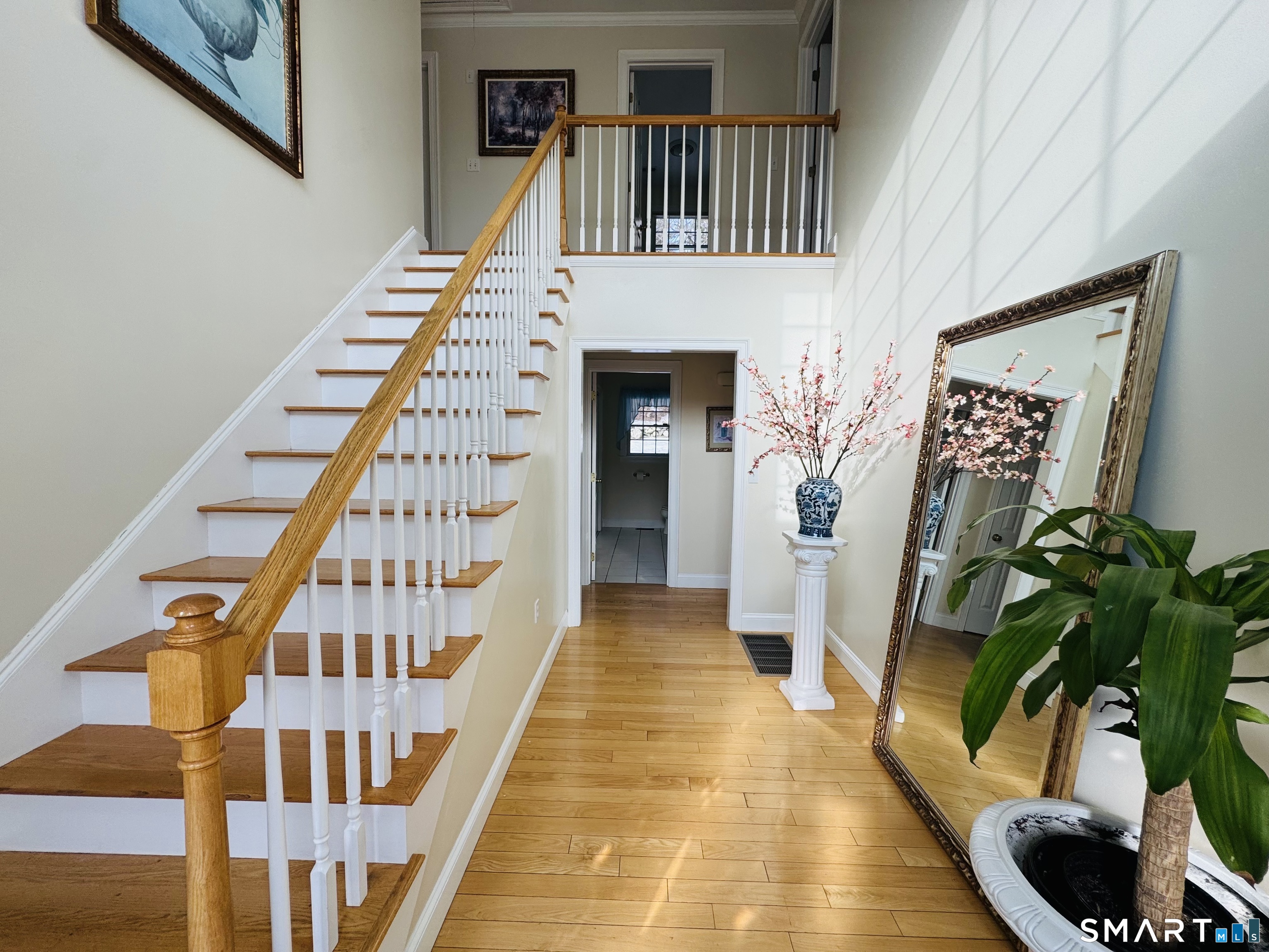 1350 Thompson Road Thompson, CT 06277 - Photo 2 of 39 a view of a hallway with wooden floor and staircase
