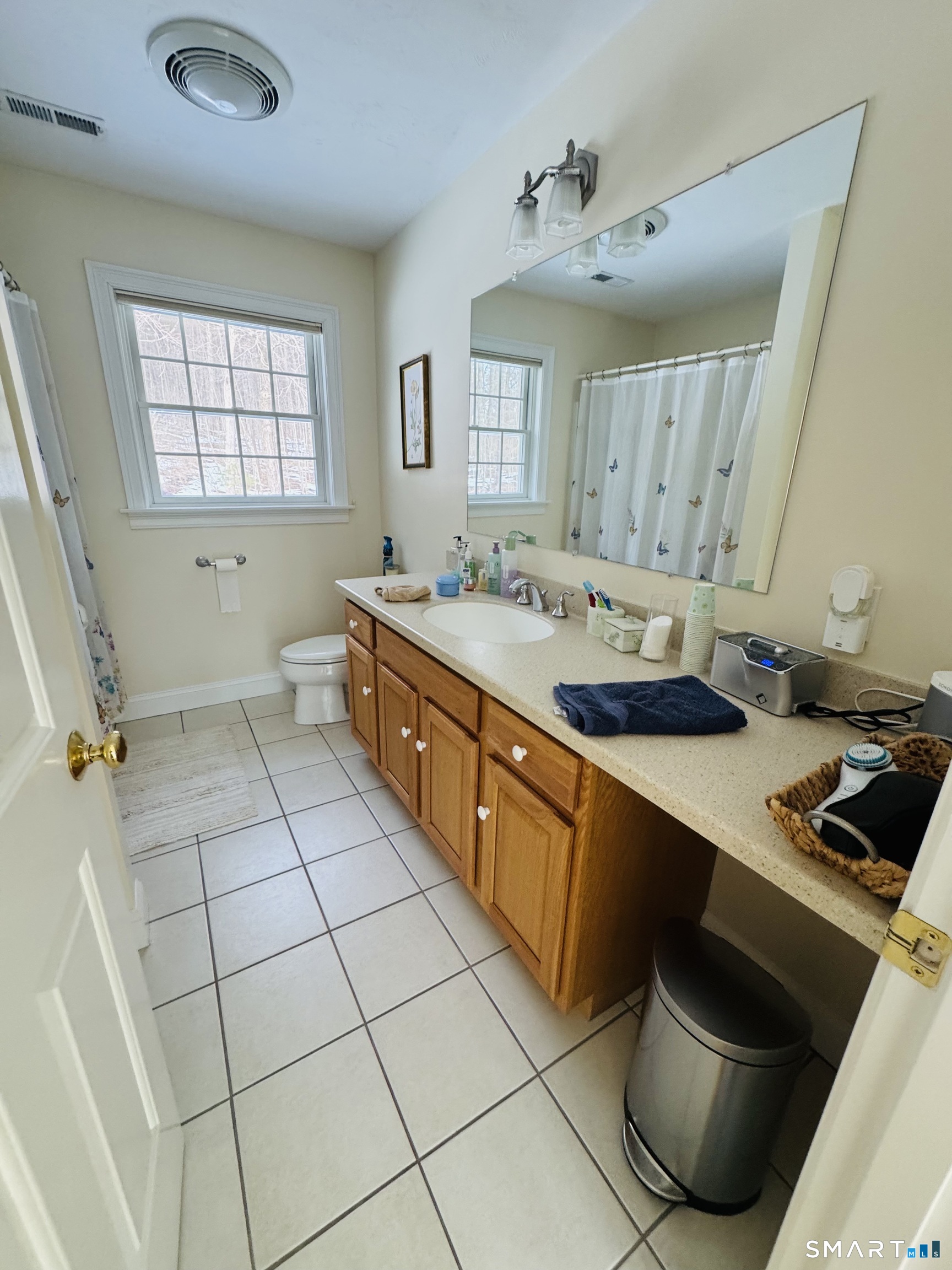 1350 Thompson Road Thompson, CT 06277 - Photo 22 of 39 a spacious bathroom with a double vanity sink a mirror and a bathtub