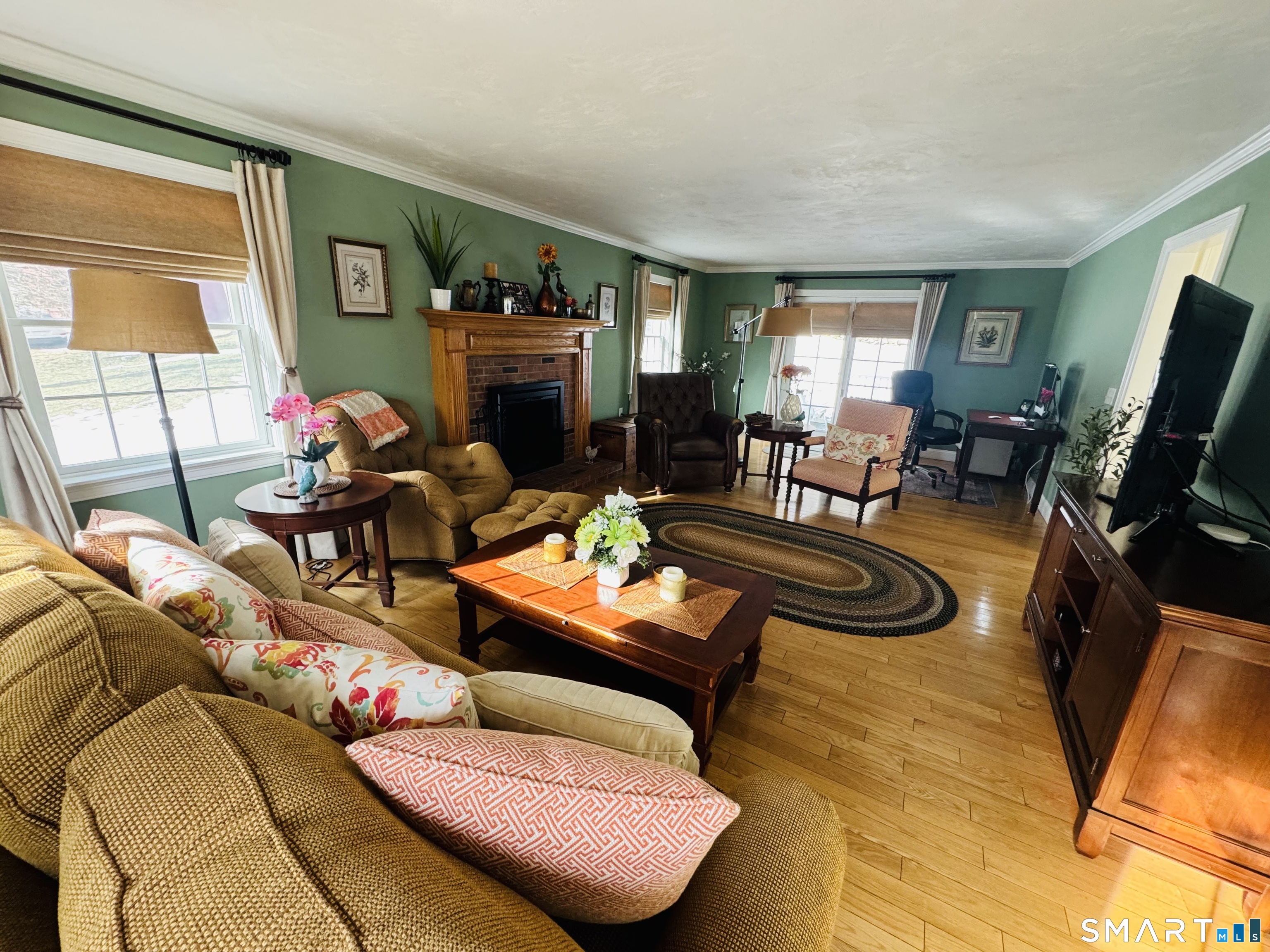 1350 Thompson Road Thompson, CT 06277 - Photo 23 of 39 a living room with furniture fireplace and flat screen tv
