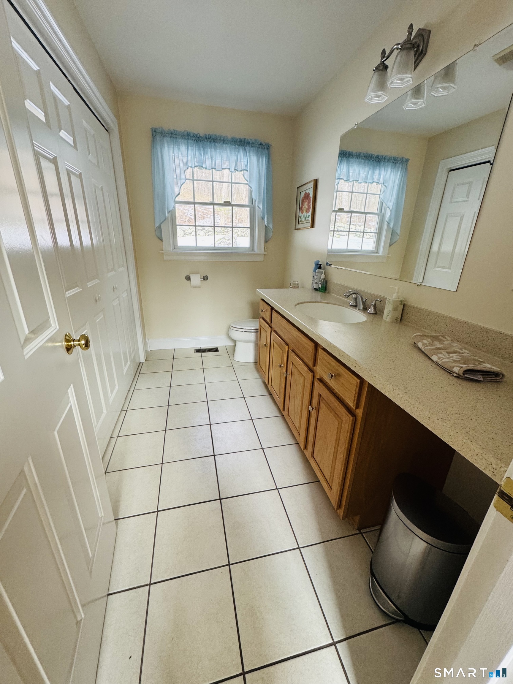 1350 Thompson Road Thompson, CT 06277 - Photo 29 of 39 a large white kitchen with a sink a toilet and a window