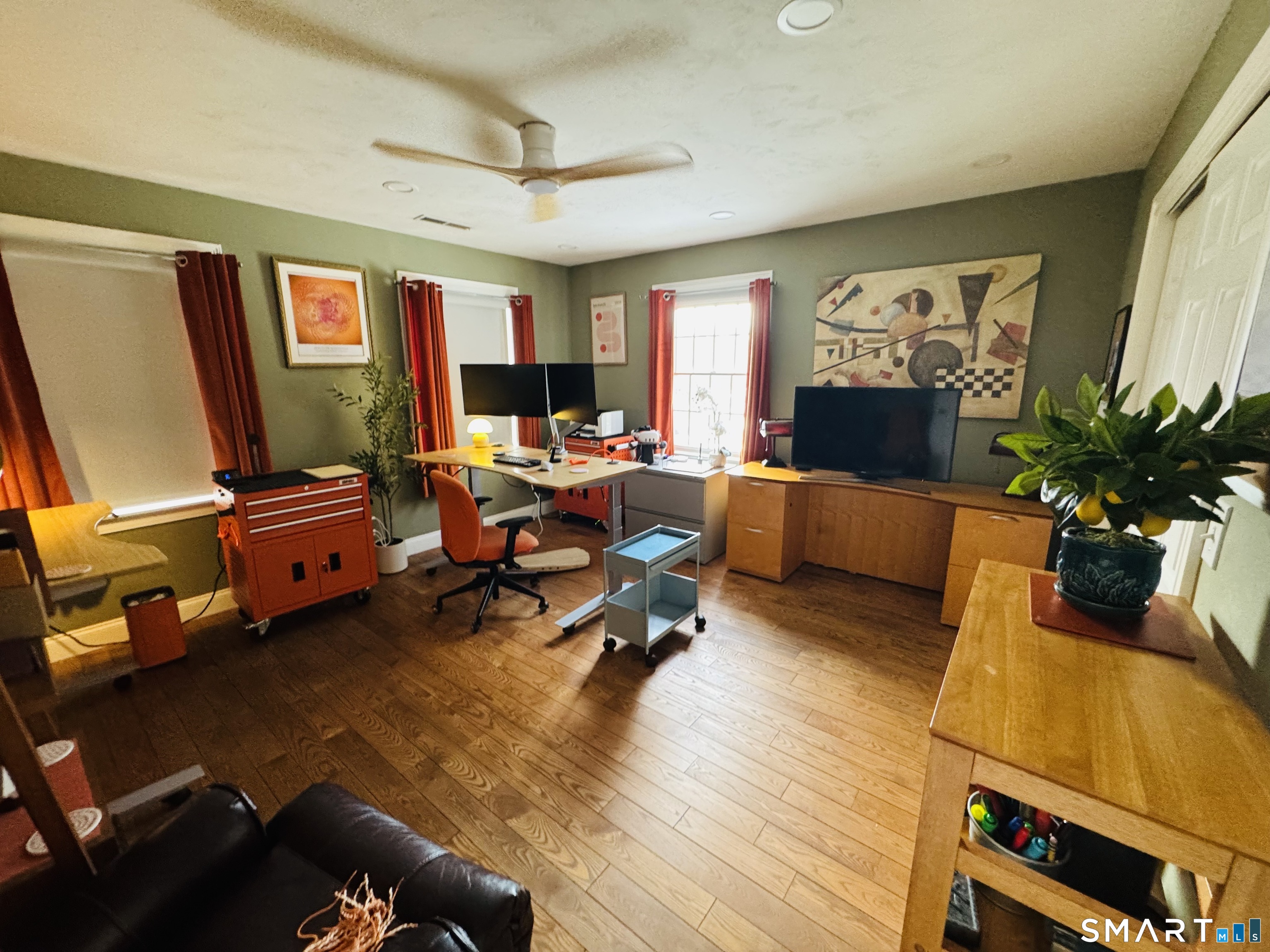 1350 Thompson Road Thompson, CT 06277 - Photo 31 of 39 a living room with furniture gym equipment and a flat screen tv