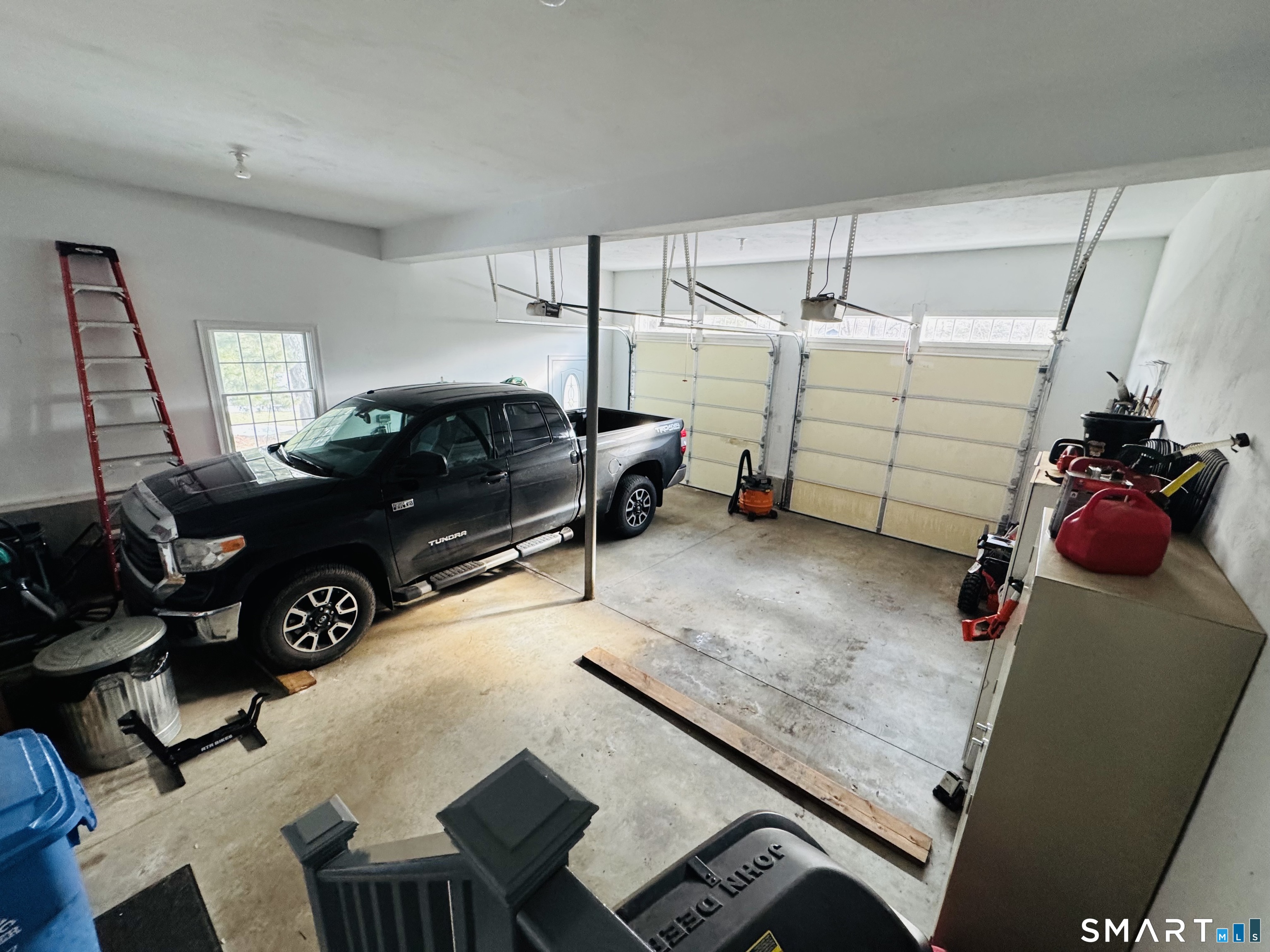 1350 Thompson Road Thompson, CT 06277 - Photo 36 of 39 a bed room with a bed and a couch
