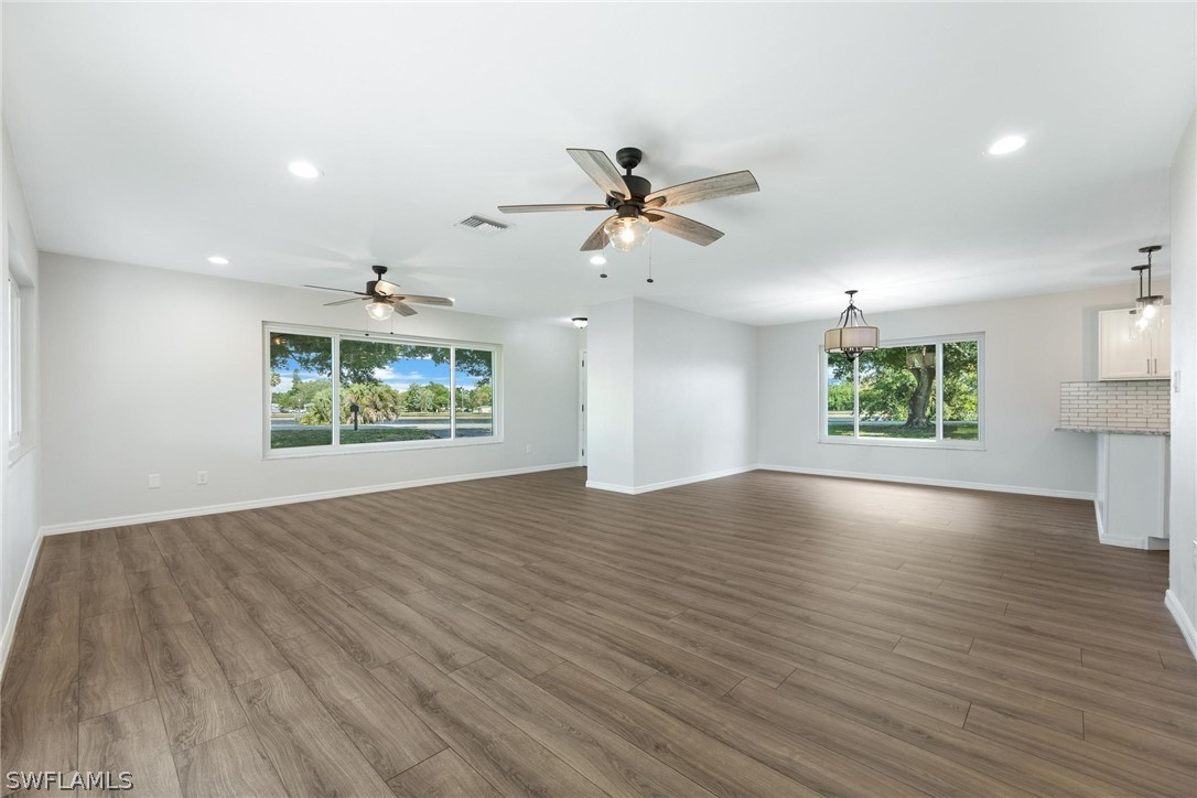 1453 River Road Moore Haven, FL 33471 - Photo 18 of 39 an empty room with windows and ceiling fan
