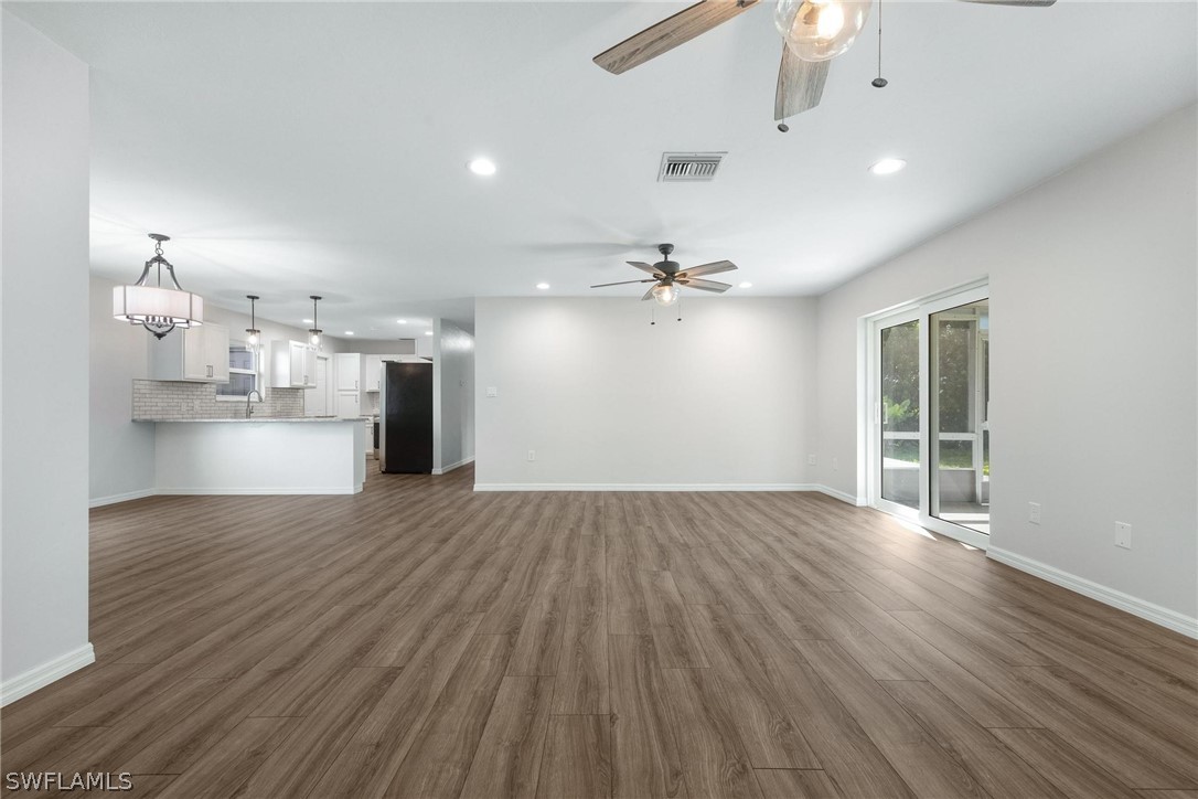 1453 River Road Moore Haven, FL 33471 - Photo 19 of 39 a view of empty room with wooden floor