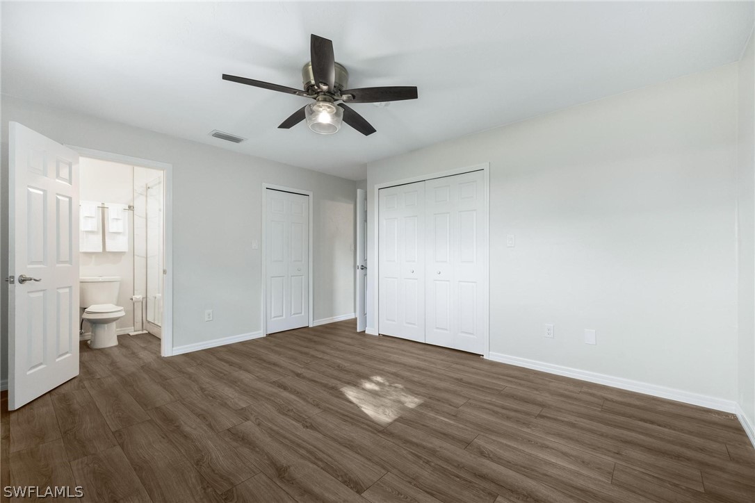 1453 River Road Moore Haven, FL 33471 - Photo 23 of 39 a view of an empty room with wooden floor and a window