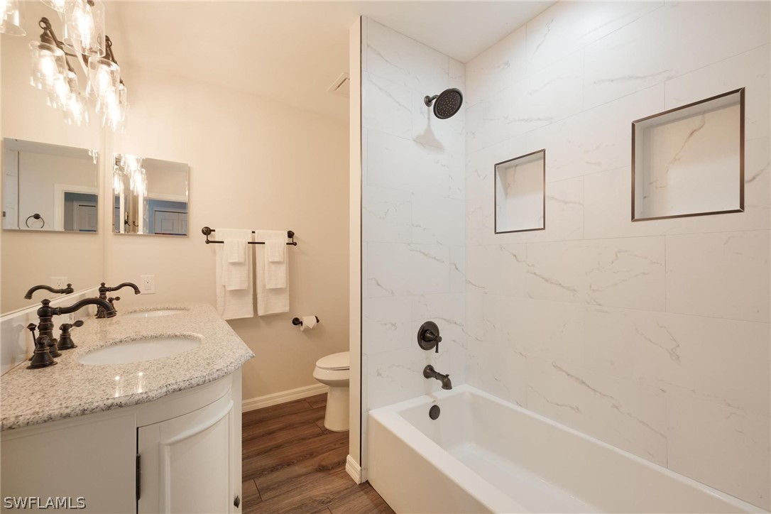 1453 River Road Moore Haven, FL 33471 - Photo 24 of 39 a bathroom with a tub sink and mirror