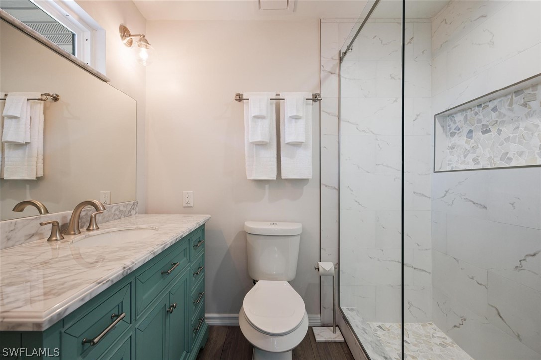 1453 River Road Moore Haven, FL 33471 - Photo 25 of 39 a bathroom with a toilet sink and mirror