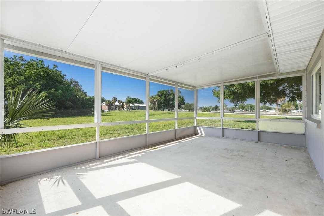 1453 River Road Moore Haven, FL 33471 - Photo 26 of 39 a view of a room with wooden floor and fence