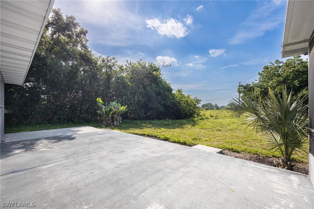 1453 River Road Moore Haven, FL 33471 - Photo 29 of 39 a view of a house with a yard and garage