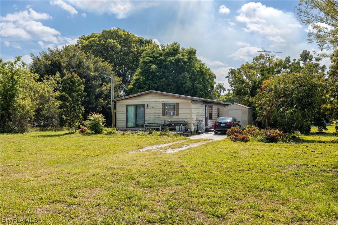 1453 River Road Moore Haven, FL 33471 - Photo 33 of 39 a view of a house with swimming pool and sitting area