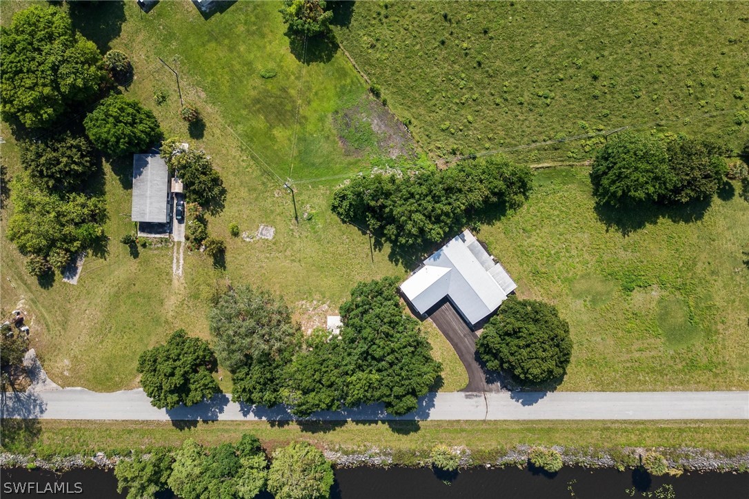 1453 River Road Moore Haven, FL 33471 - Photo 36 of 39 an aerial view of residential house with pool and yard