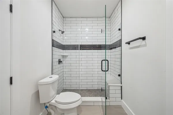 an empty room with windows and entrance