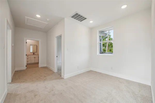 a bathroom with double sink and a mirror