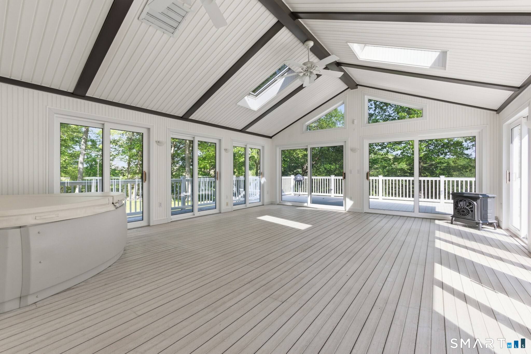 70 Mahoney Road Colchester, CT 06415 - Photo 21 of 40 a view of an empty room with wooden floor and a window