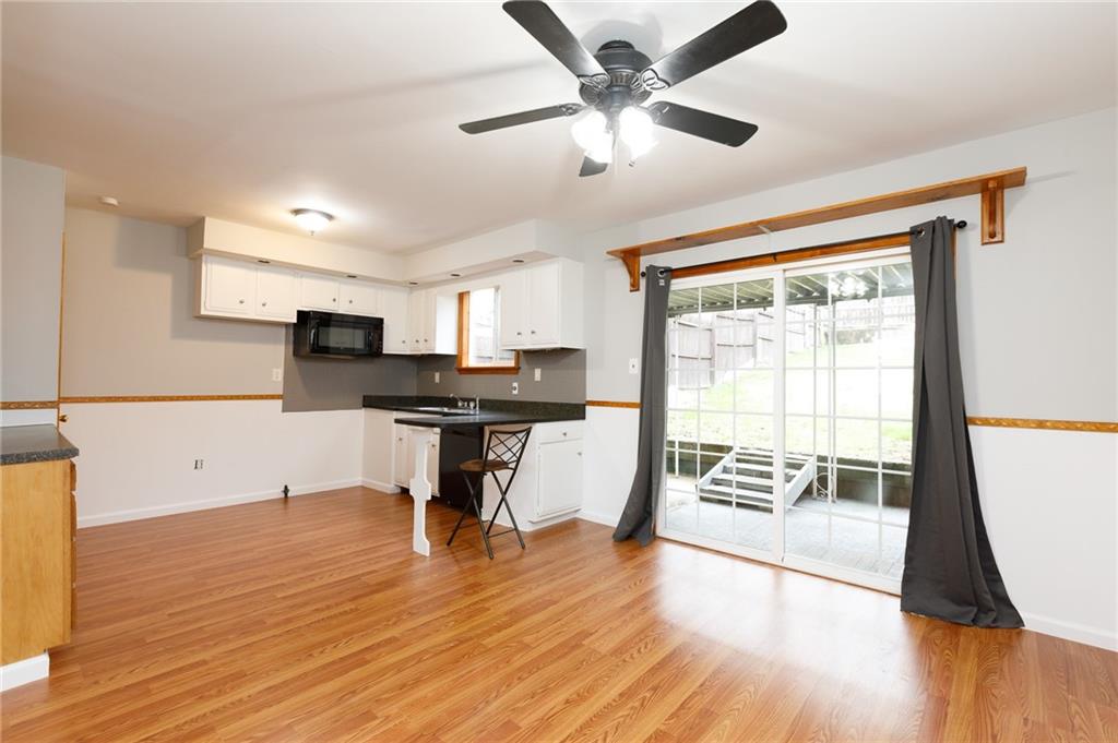 826 Ridge Avenue McKees Rocks, PA 15136 - Photo 11 of 22 a view of an empty room with a window and wooden floor