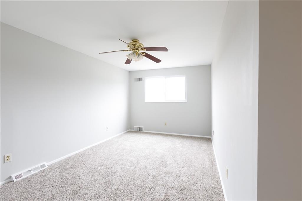 826 Ridge Avenue McKees Rocks, PA 15136 - Photo 12 of 22 an empty room with a window and a fan