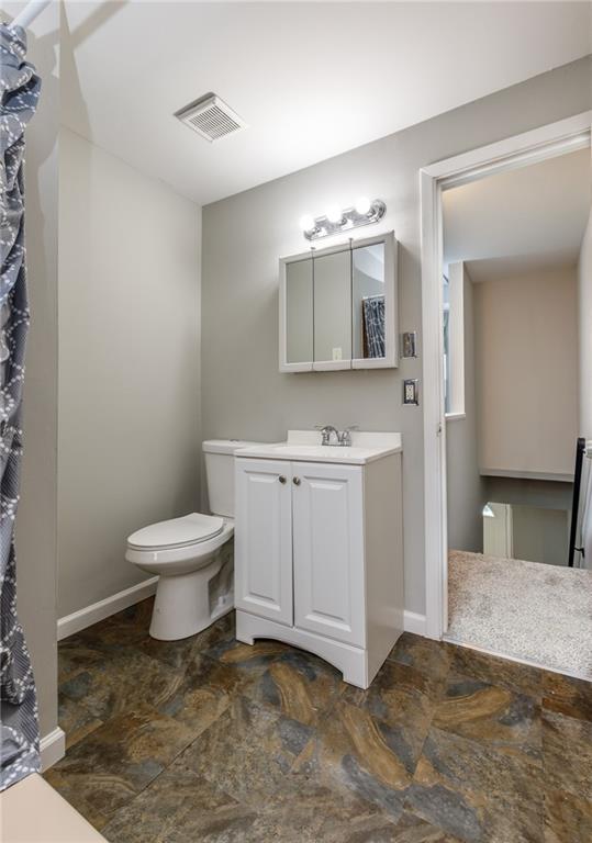 826 Ridge Avenue McKees Rocks, PA 15136 - Photo 16 of 22 a bathroom with a sink toilet and mirror