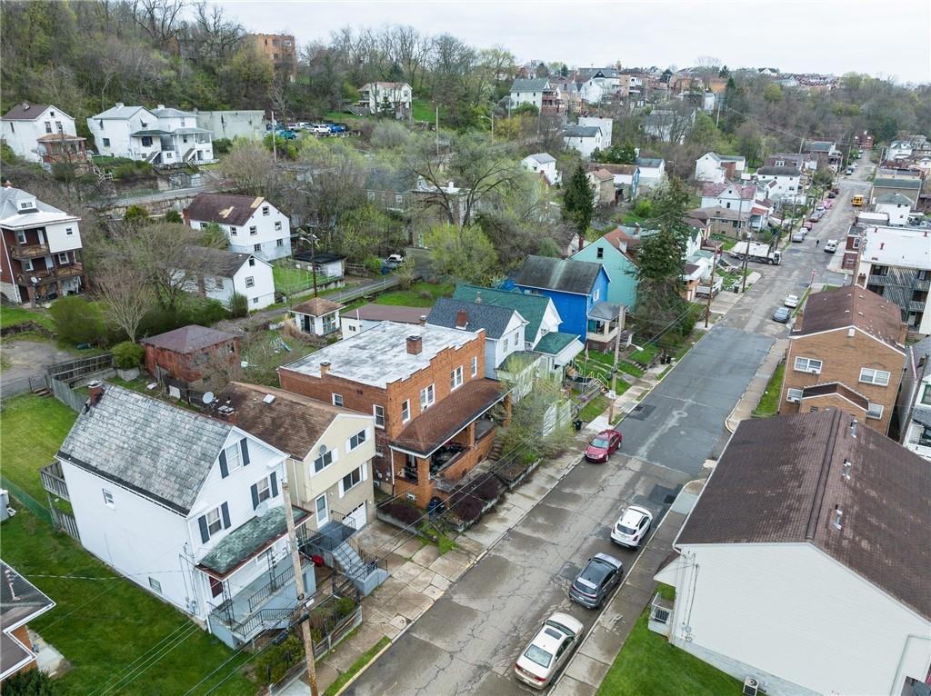 826 Ridge Avenue McKees Rocks, PA 15136 - Photo 21 of 22 an aerial view of multiple houses with yard