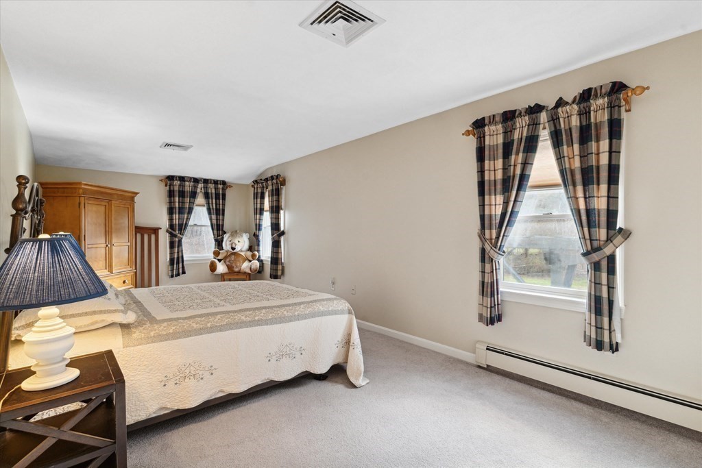 13 Highland Road Boxford, MA 01921 - Photo 11 of 35 a bed room with a bed and a window