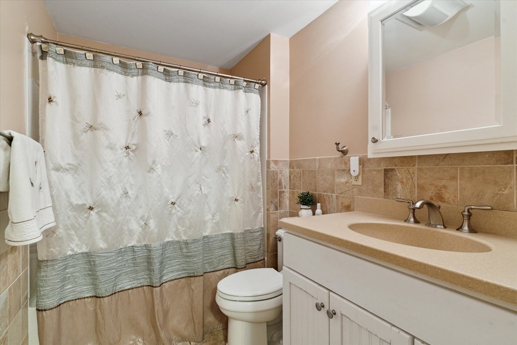 13 Highland Road Boxford, MA 01921 - Photo 12 of 35 a bathroom with a sink a toilet and shower