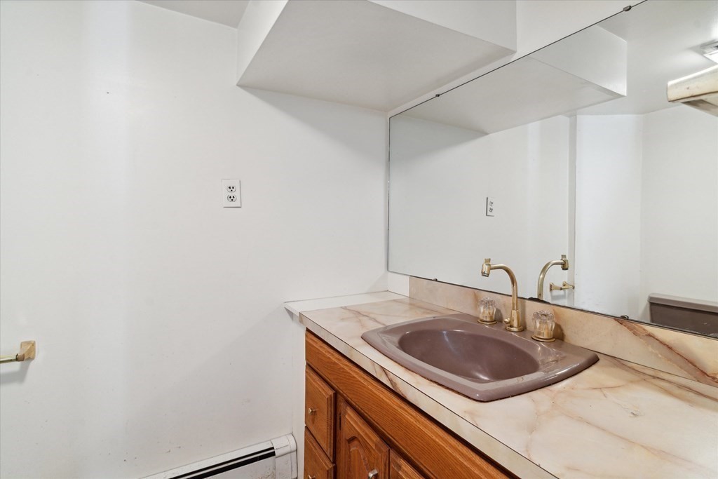 13 Highland Road Boxford, MA 01921 - Photo 13 of 35 a bathroom with a sink and a mirror