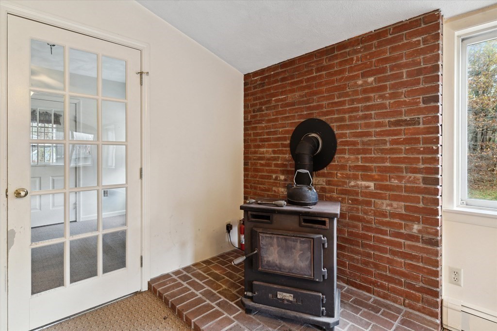13 Highland Road Boxford, MA 01921 - Photo 16 of 35 a living room with a fireplace