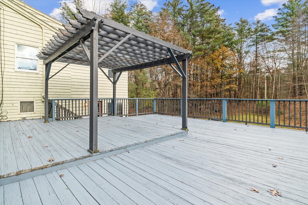 13 Highland Road Boxford, MA 01921 - Photo 21 of 35 a view of outdoor space with wooden floor and iron fence