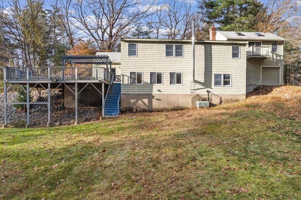 13 Highland Road Boxford, MA 01921 - Photo 25 of 35 a view of a house with a yard and sitting area