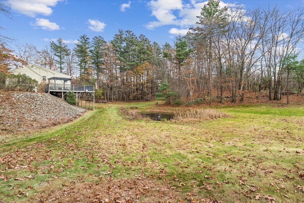 13 Highland Road Boxford, MA 01921 - Photo 26 of 35 a backyard of a house with lots of green space