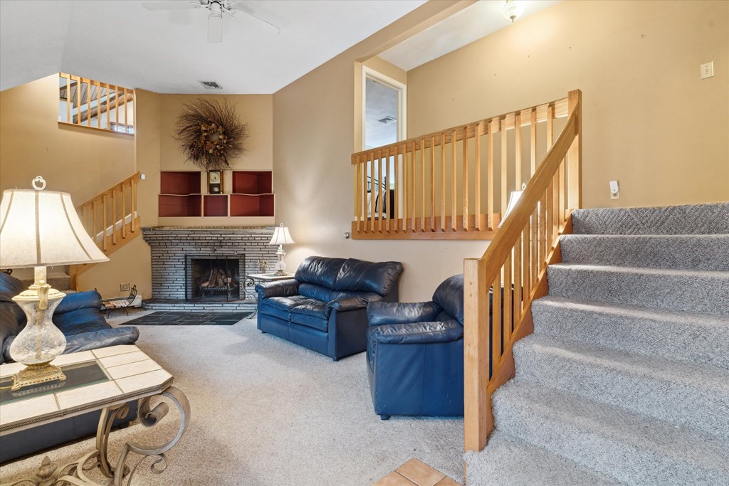 13 Highland Road Boxford, MA 01921 - Photo 3 of 35 a living room with furniture and a fireplace