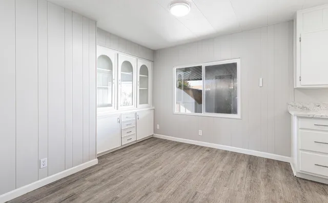 wooden floor in an empty room and a window