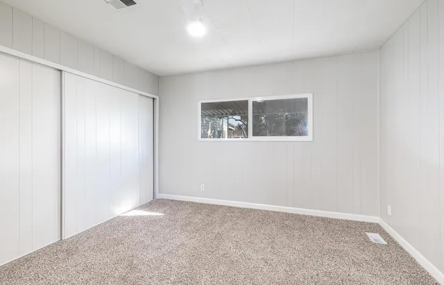 a view of an empty room with a window