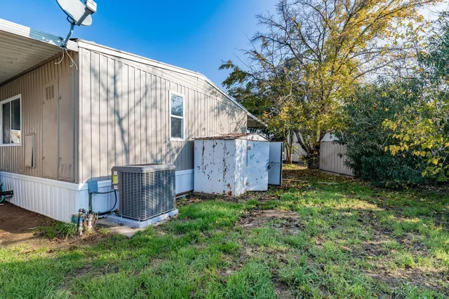a backyard of a house with lots of green space