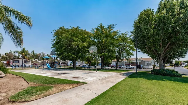 a view of a park with swings and slides