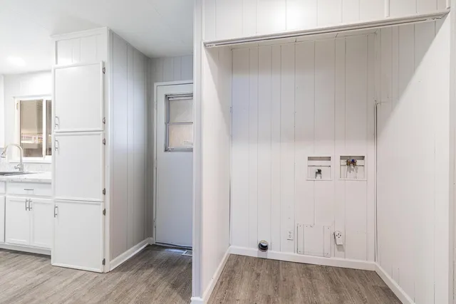 a view of walk in closet with white walls