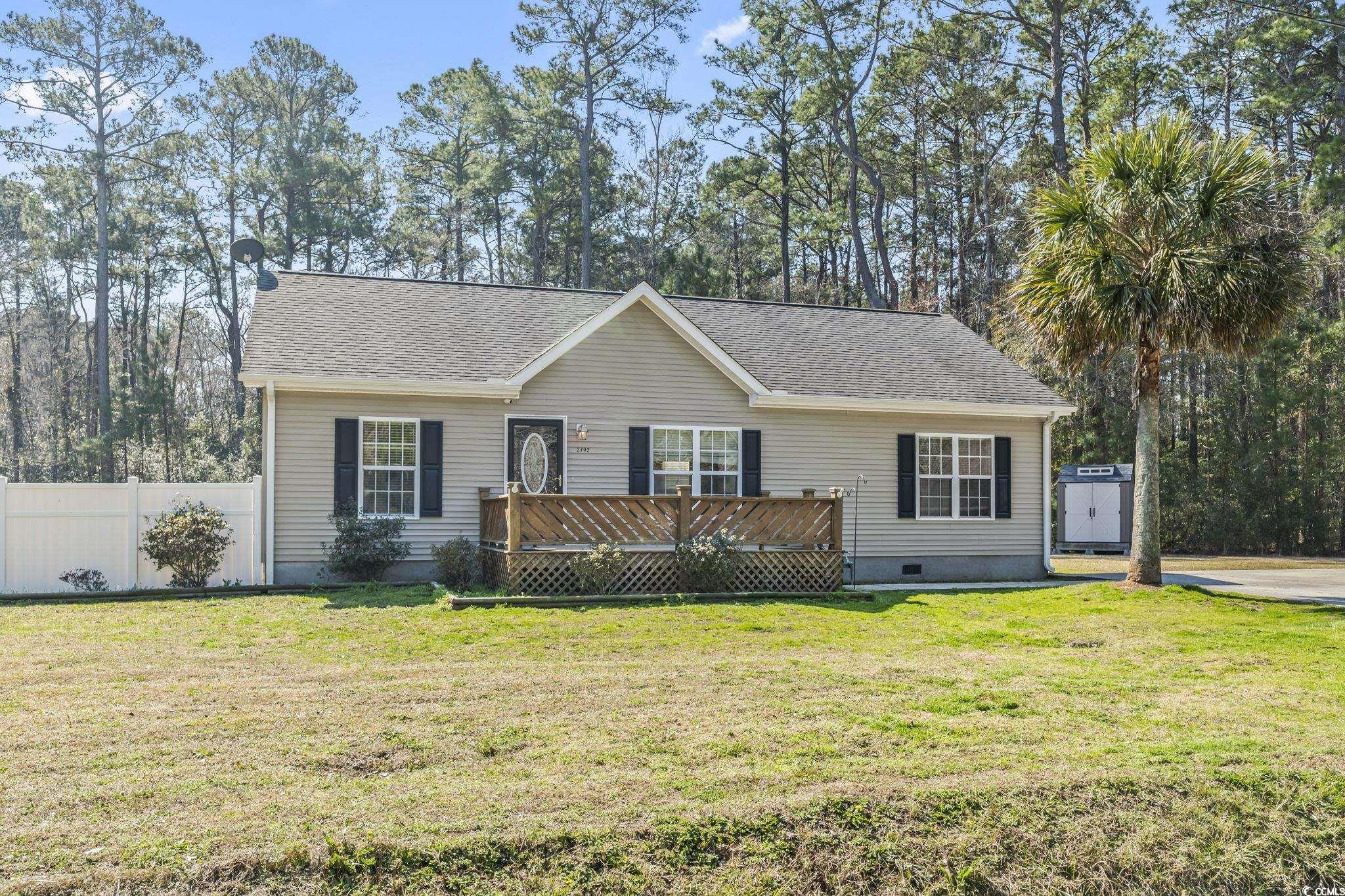 2192 Bell Road Longs, SC 29568 - Photo 1 of 19 Ranch-style house with a shingled roof, a front ya